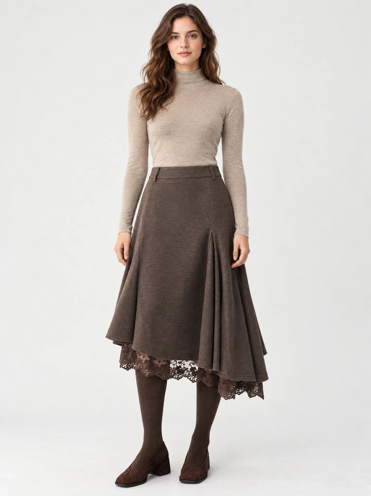 Front studio view of a model wearing a Brown cotton asymmetric hem midi skirt with a flared silhouette and lace-trimmed underlayer.