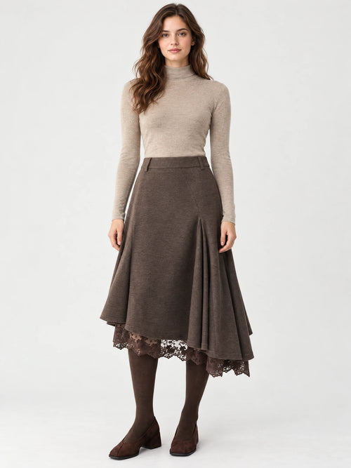 Front studio view of a model wearing a Brown cotton asymmetric hem midi skirt with a flared silhouette and lace-trimmed underlayer.