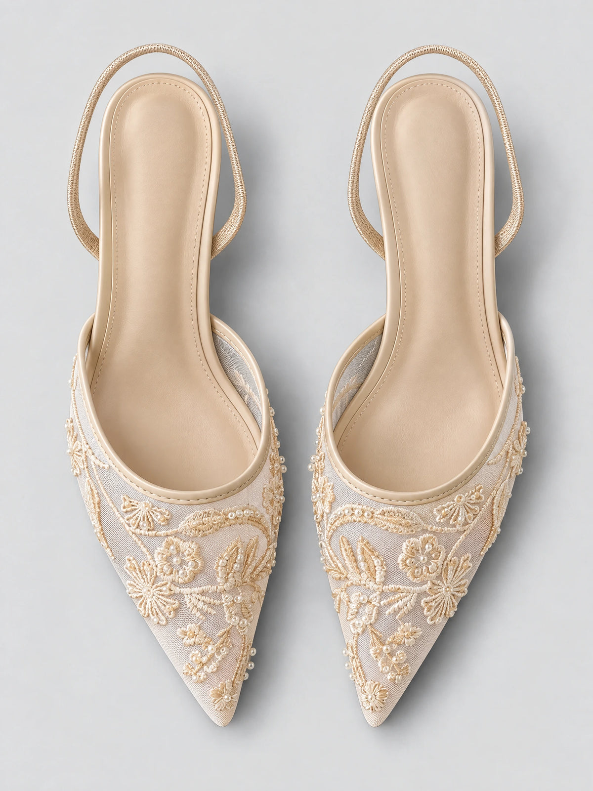 Top-down view of Beige Back Strap Slingback High Heels with pointed toes, floral embroidery, and bead embellishments.