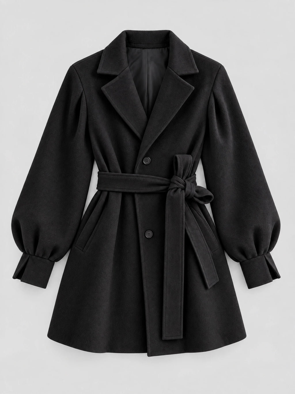 Black belted wool coat laid flat, featuring lantern sleeves, notched lapels, button front, and a tied waist belt.