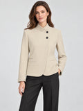 Front studio view of a model wearing a Beige Blazer Blouse with an asymmetric stand collar, dark buttons, and welt pockets.