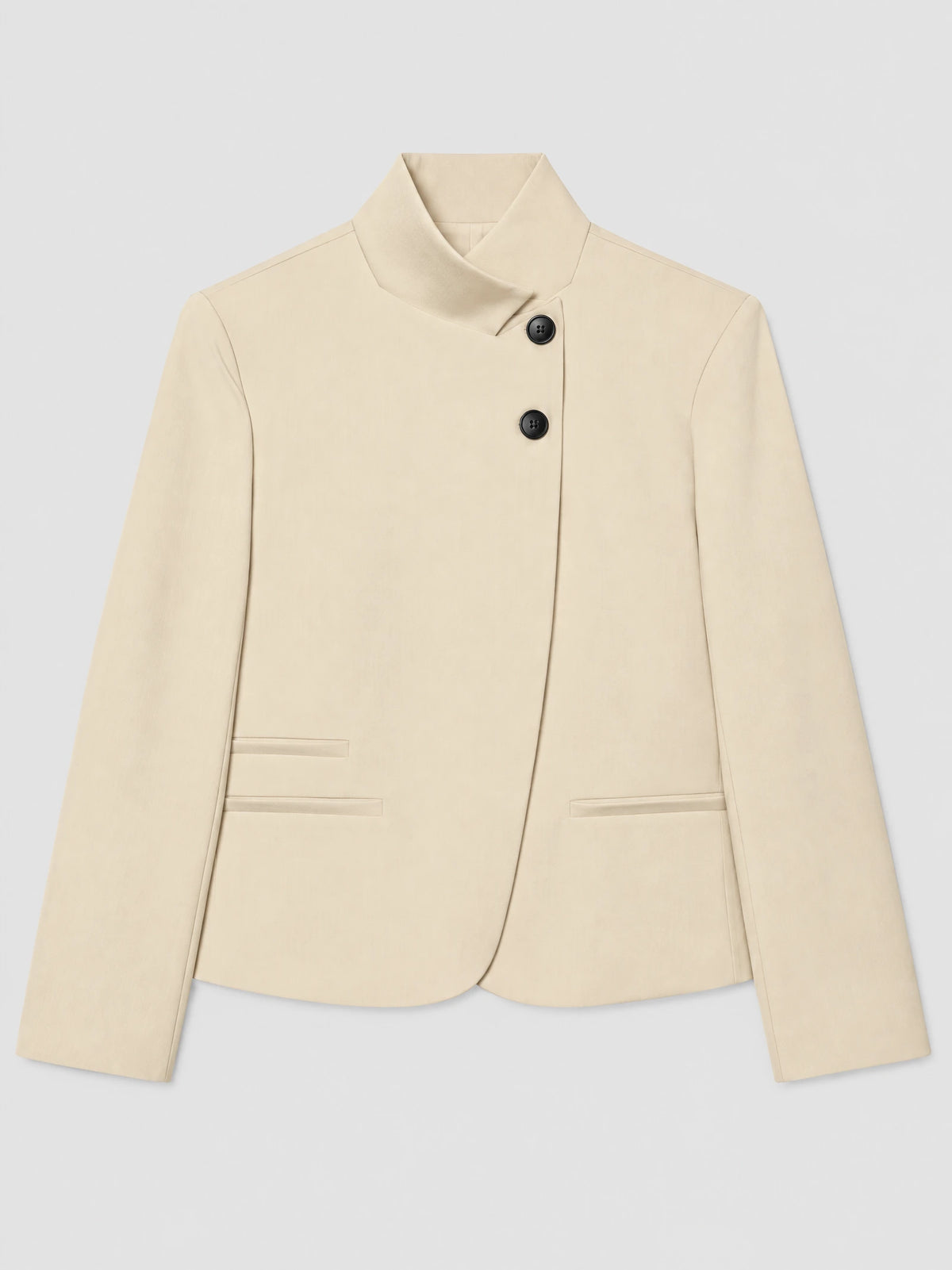 Beige Blazer Blouse laid flat, featuring an asymmetric folded collar, two-button closure, long sleeves, and welt pockets.