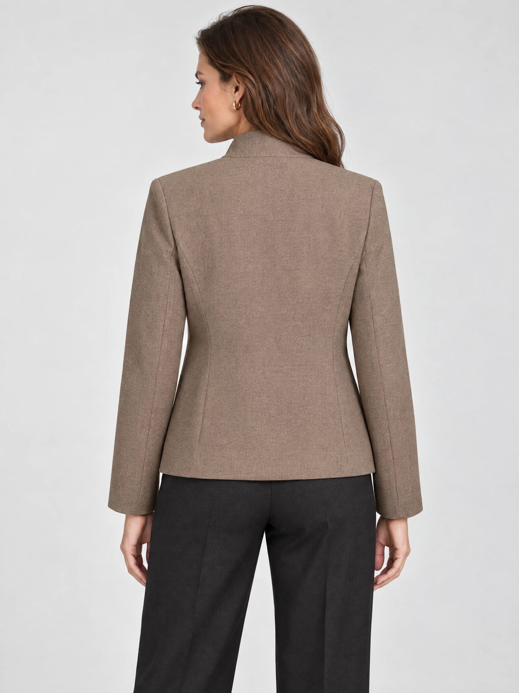 Rear view of a model wearing a Brown Blazer Blouse with tailored back seams and long sleeves.