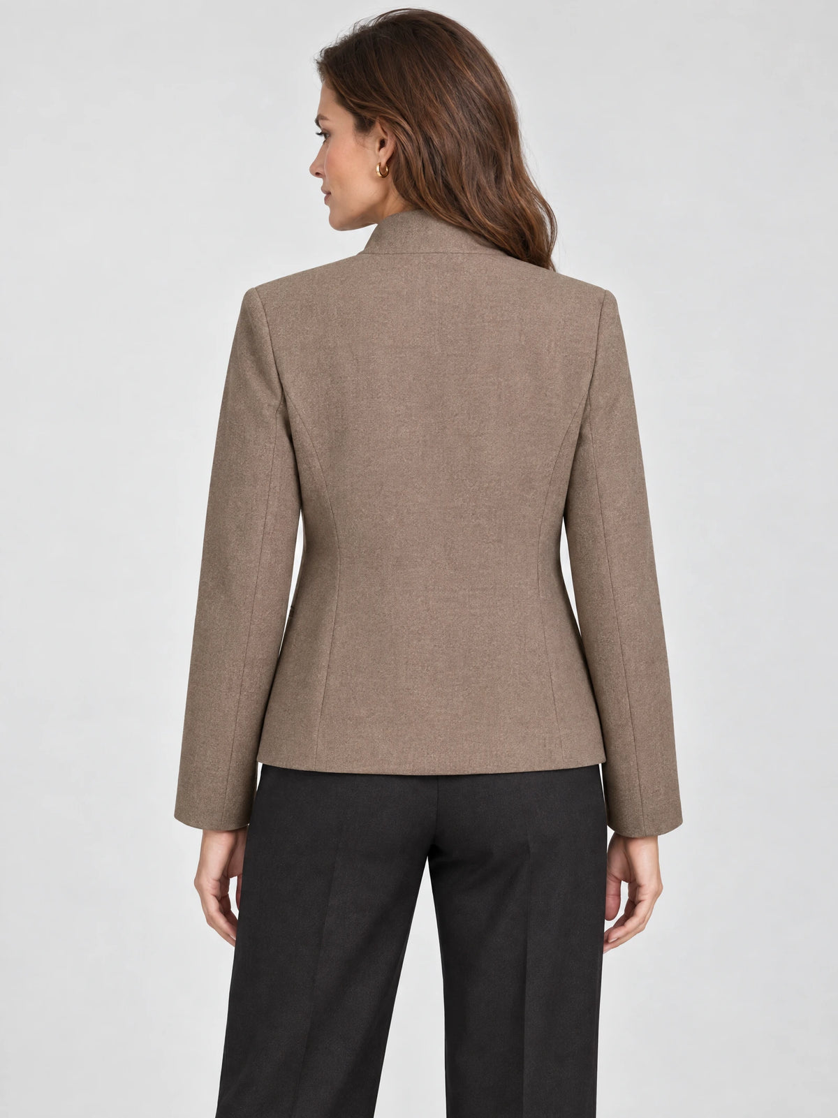 Rear view of a model wearing a Brown Blazer Blouse with tailored back seams and long sleeves.