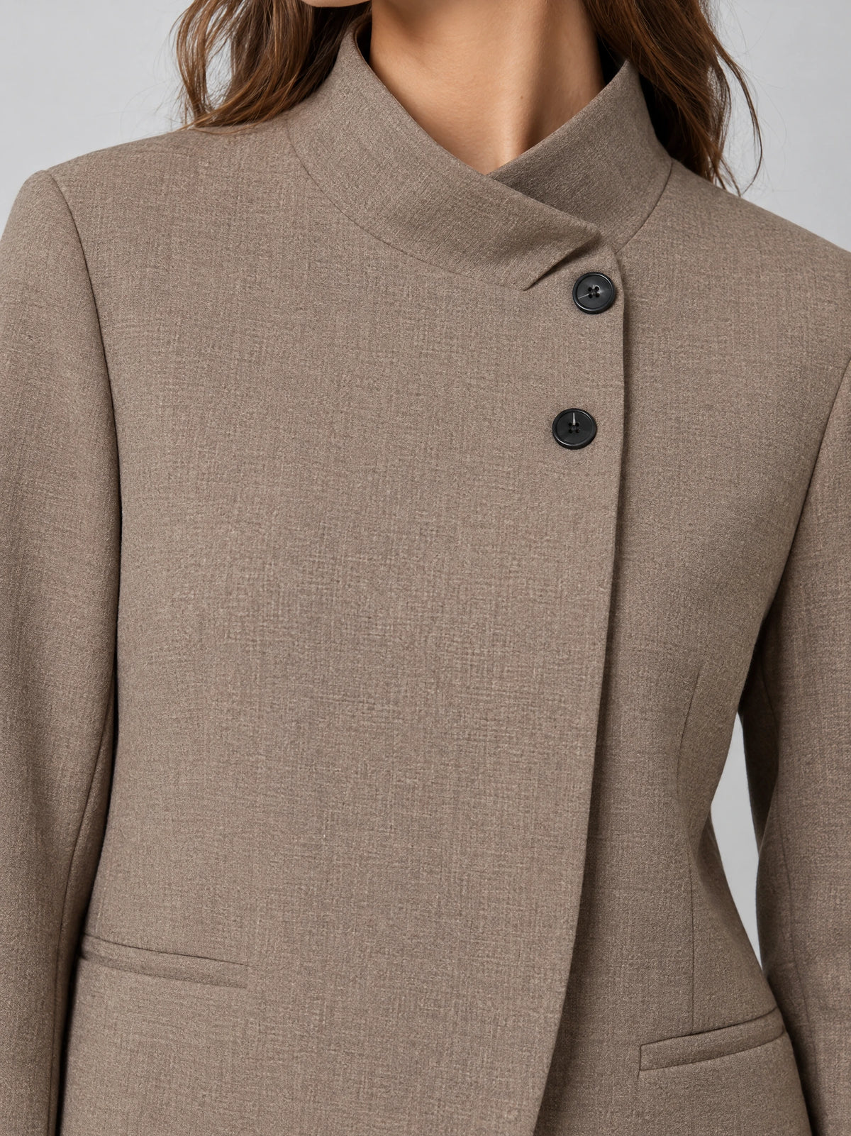 Close-up of the Brown Blazer Blouse showing its textured fabric, asymmetric stand collar, and button closure.