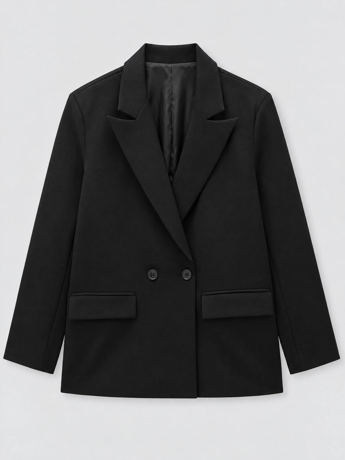 Black double breasted blazer laid flat, featuring notched lapels, two front buttons, and flap pockets.