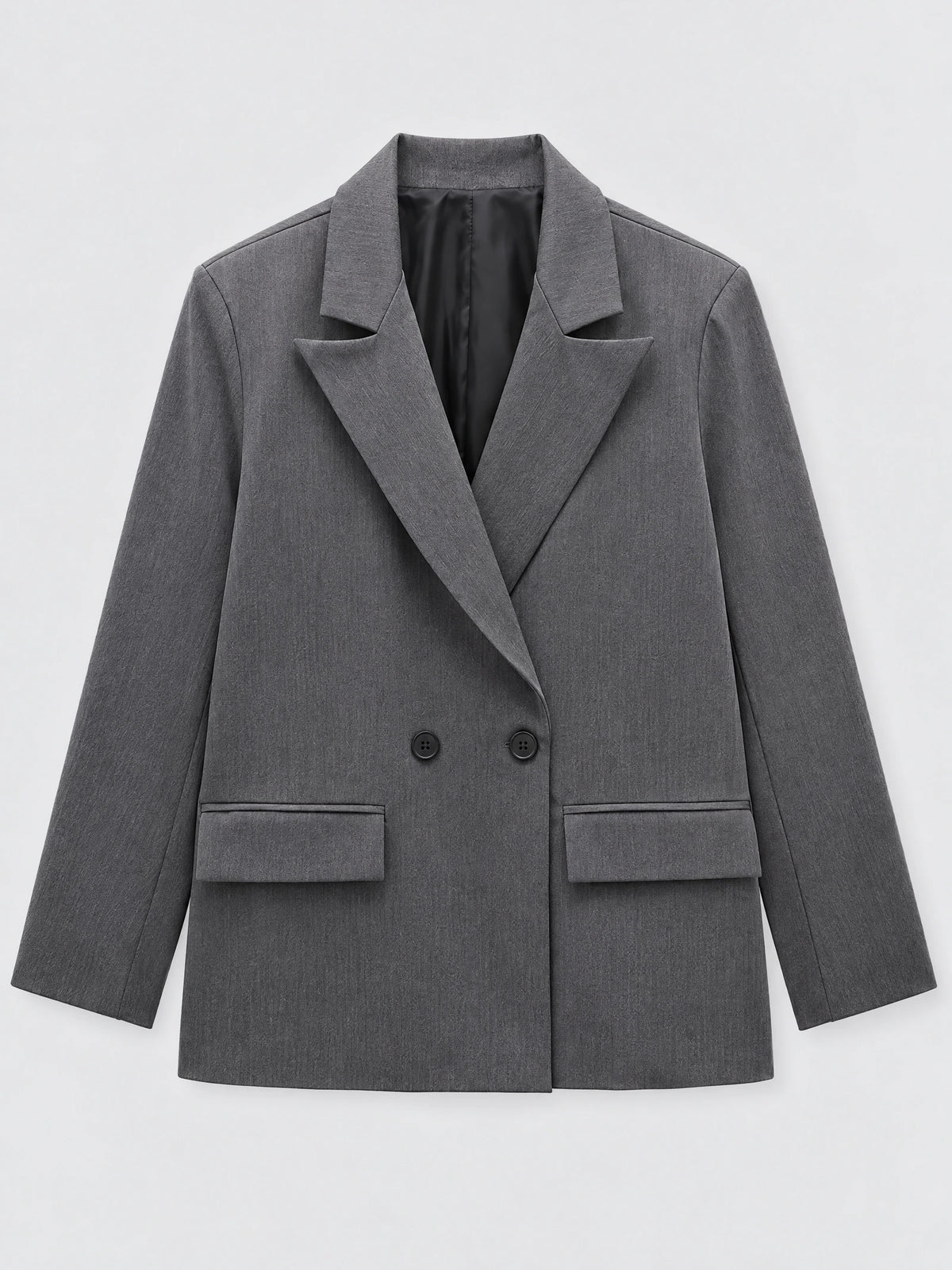 Gray double breasted blazer laid flat, featuring notched lapels, front buttons, and flap pockets.