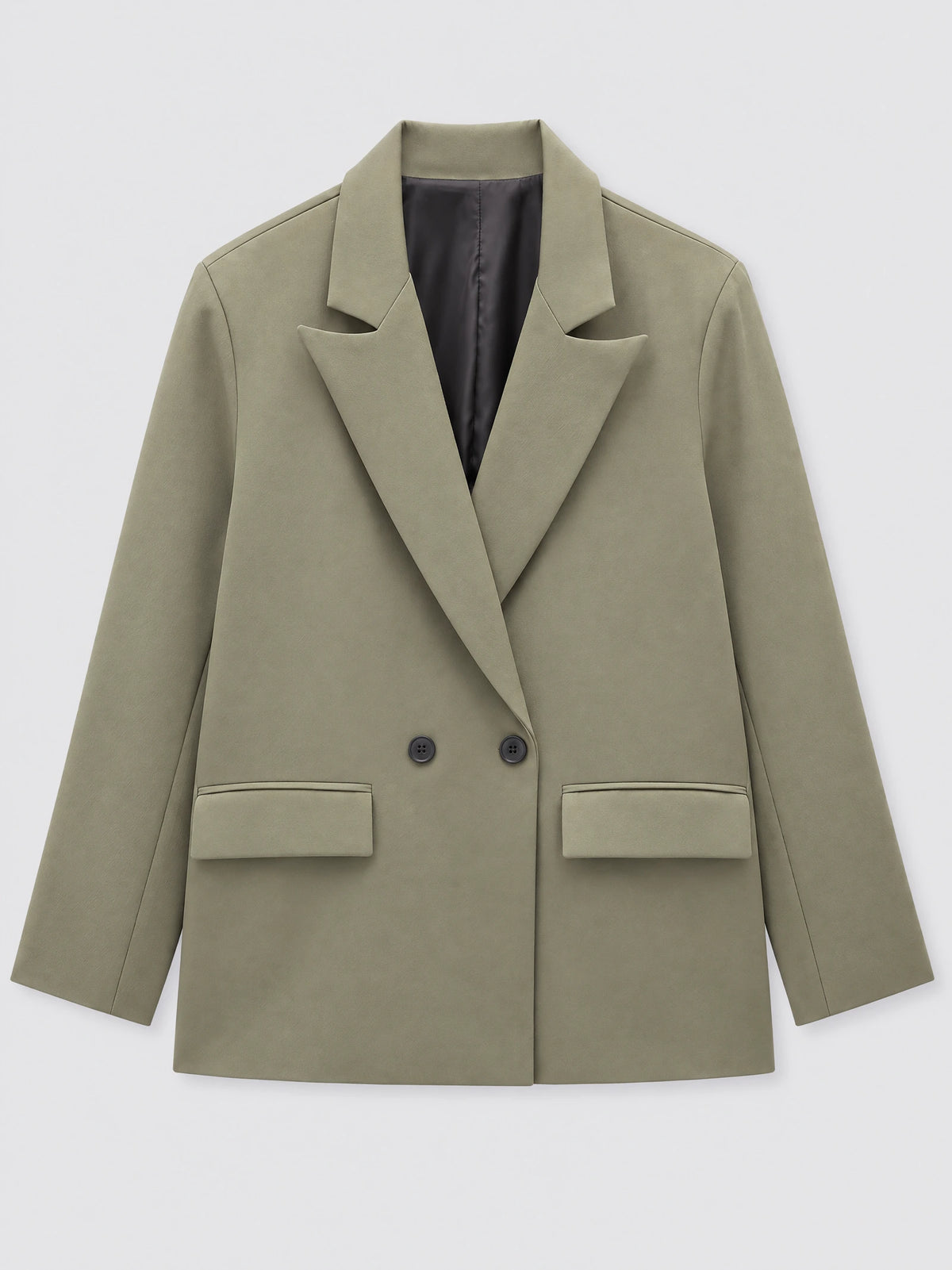 Green double breasted blazer laid flat, featuring peaked lapels, flap pockets, and dark buttons.