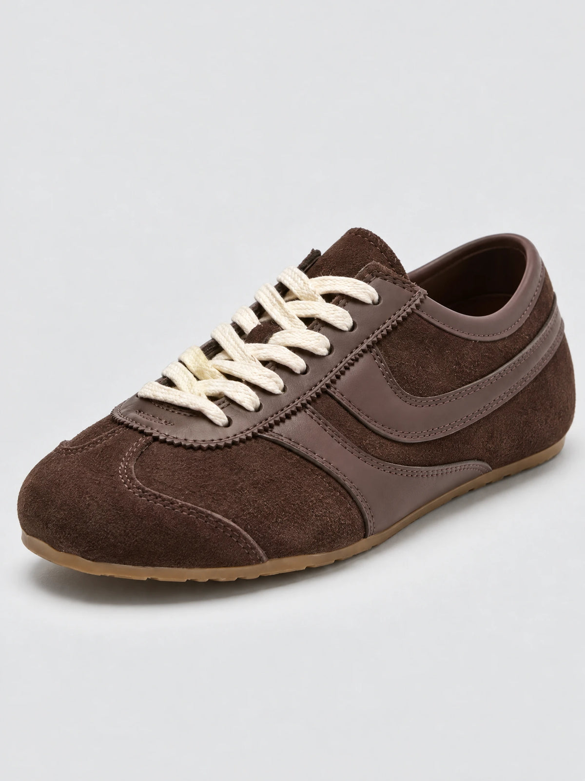 Three-quarter close-up of a Brown Gats Shoes leather sneaker with textured panels, stitched overlays, and lace-up front.