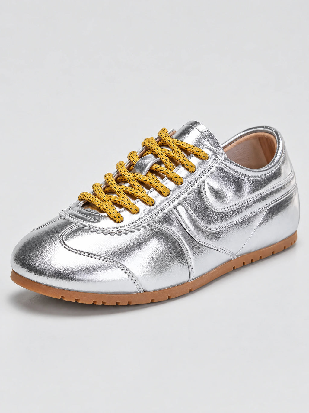 Three-quarter view of Gray leather Gats Shoes sneakers with patterned laces, stitched overlays, and a textured rubber sole.
