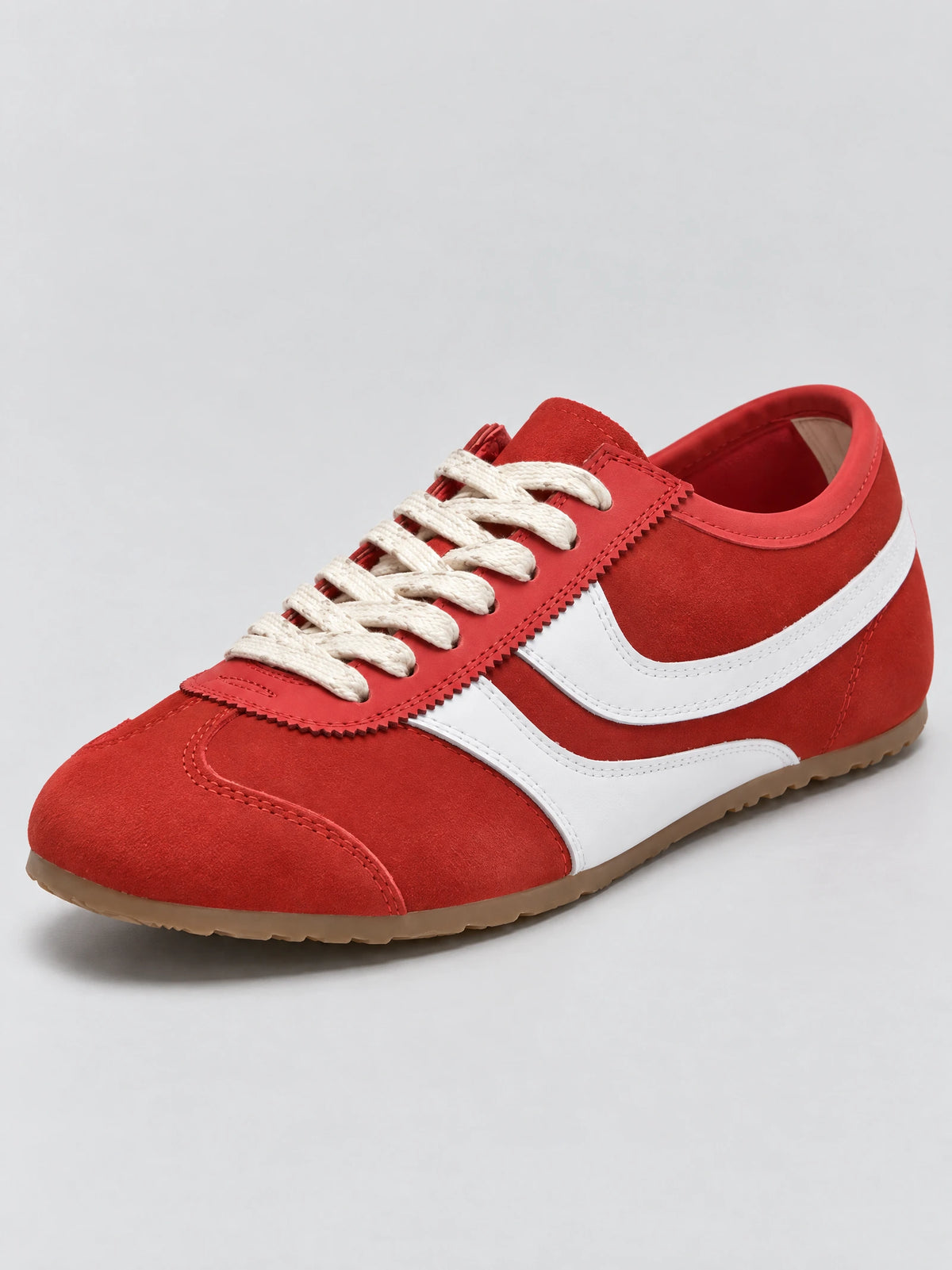 Three-quarter view of Red Gats Shoes leather lace-up sneaker with contrast side stripe and textured sole.