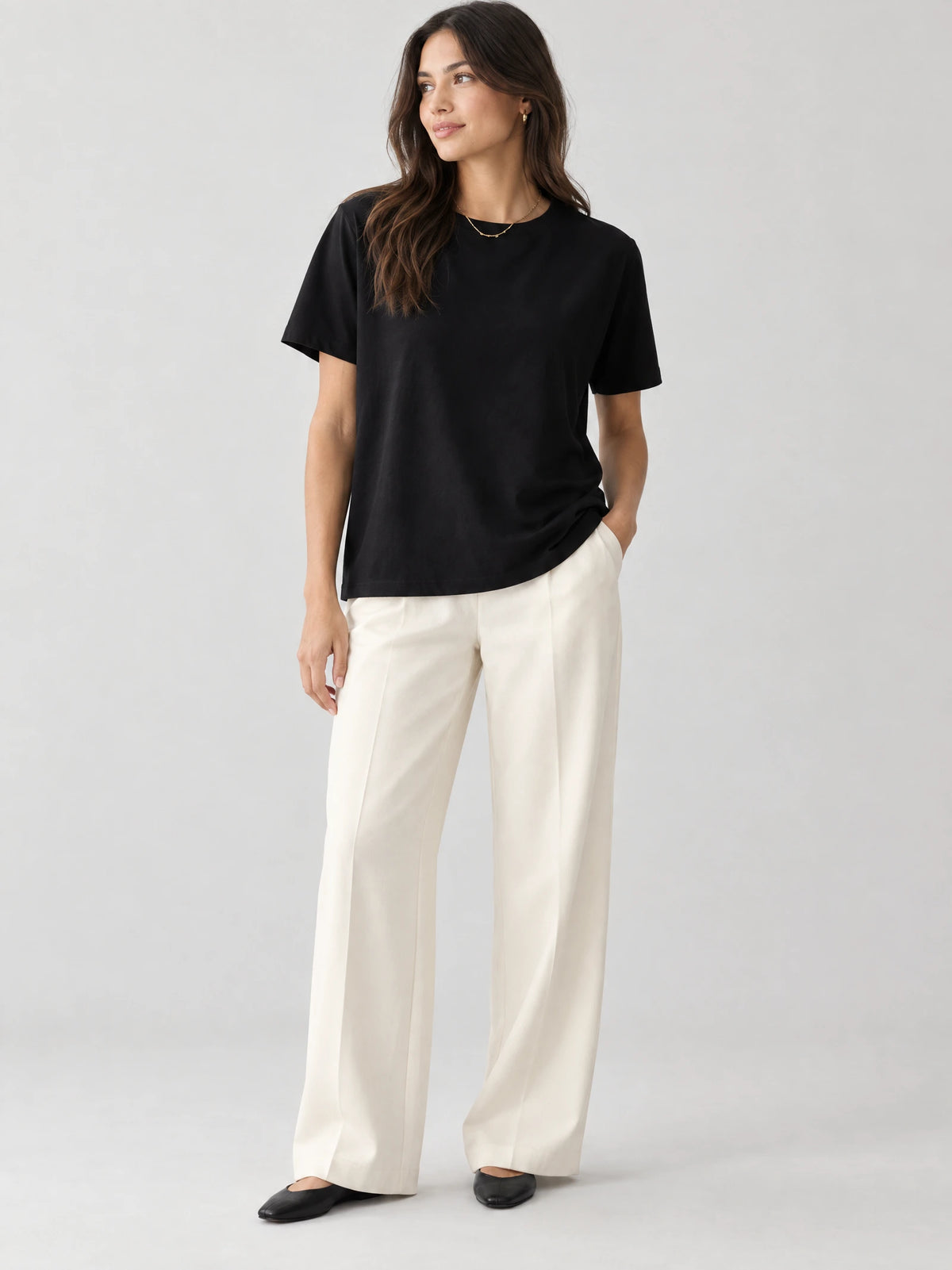 Model wearing a Black heavyweight cotton T-shirt with a crew neckline and short sleeves in a front studio view.