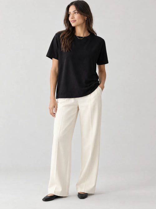 Model wearing a Black heavyweight cotton T-shirt with a crew neckline and short sleeves in a front studio view.