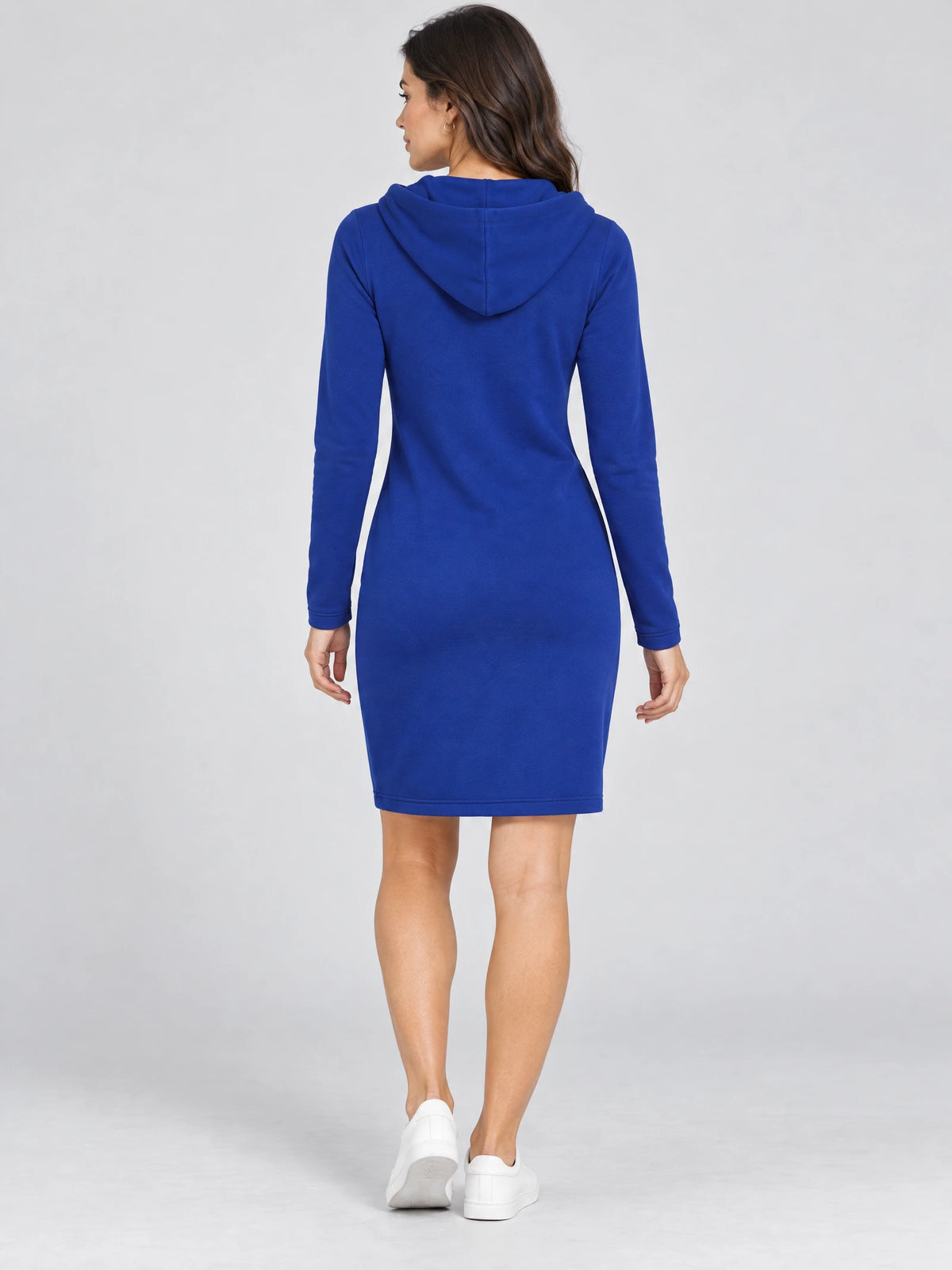 Back view of a model wearing a Blue cotton Hooded Dress with long sleeves and a knee-length hem.