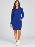 Model wearing a Blue cotton hooded dress with drawstrings and a front kangaroo pocket in a studio front view.