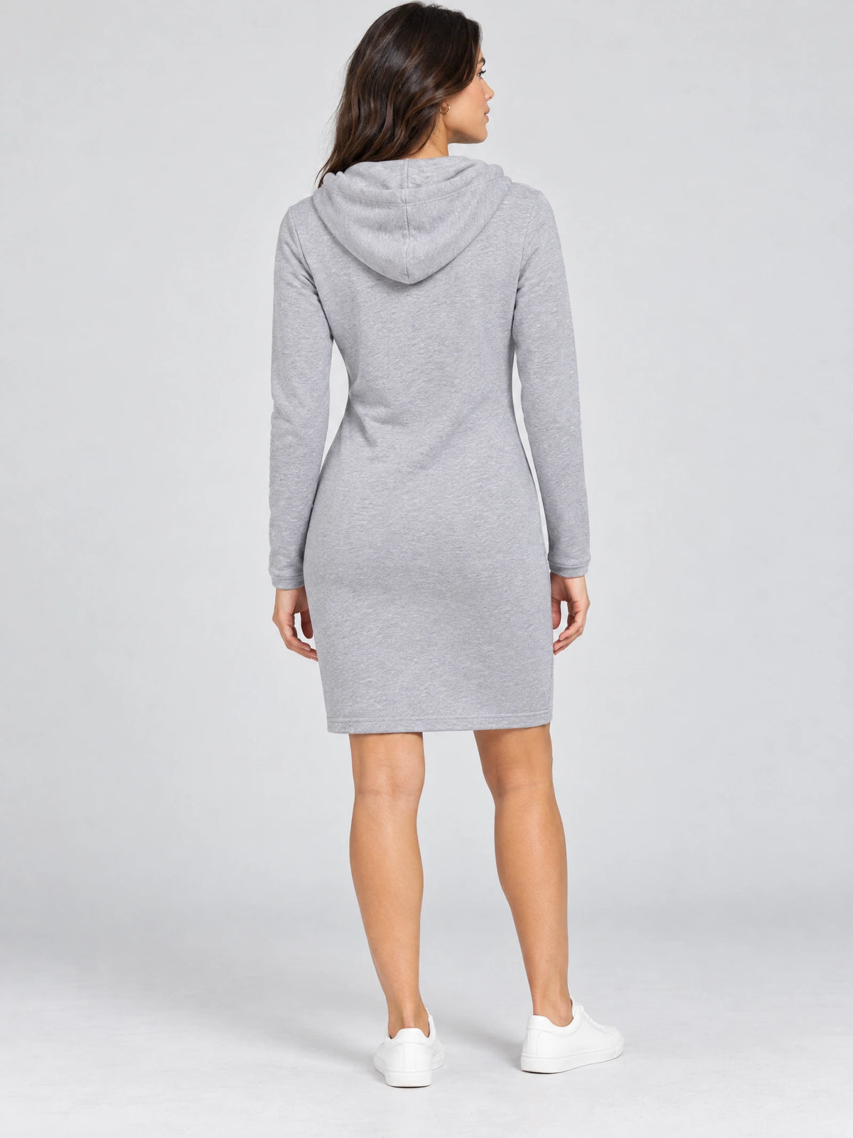 Back view of a model wearing a Gray cotton hooded dress with long sleeves and a knee-length silhouette.