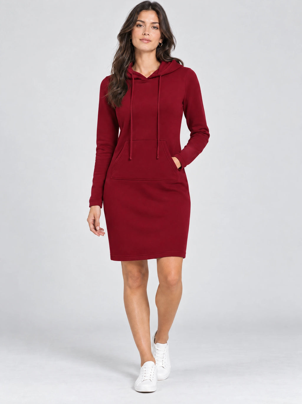 Model wearing a Red cotton hooded dress with drawstrings and a kangaroo pocket in a front studio view.