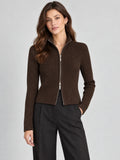 Front studio view of a model wearing a Brown ribbed knit cardigan with a high collar and two-way zip closure.