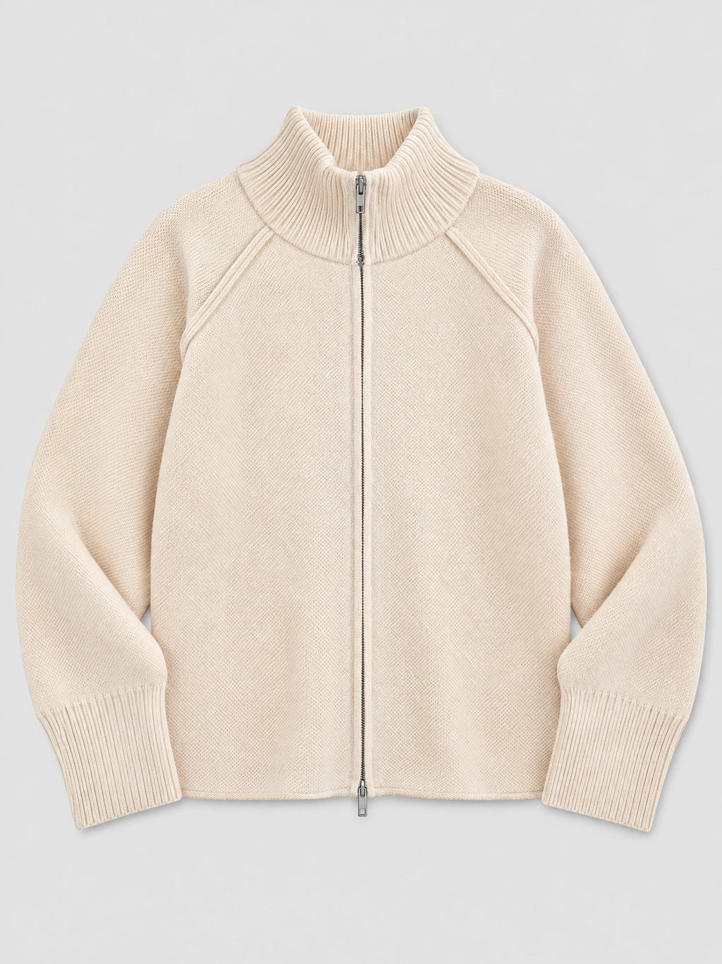 Beige Knit Full Zip Sweater laid flat, featuring a ribbed stand collar, raglan sleeves, and ribbed cuffs.