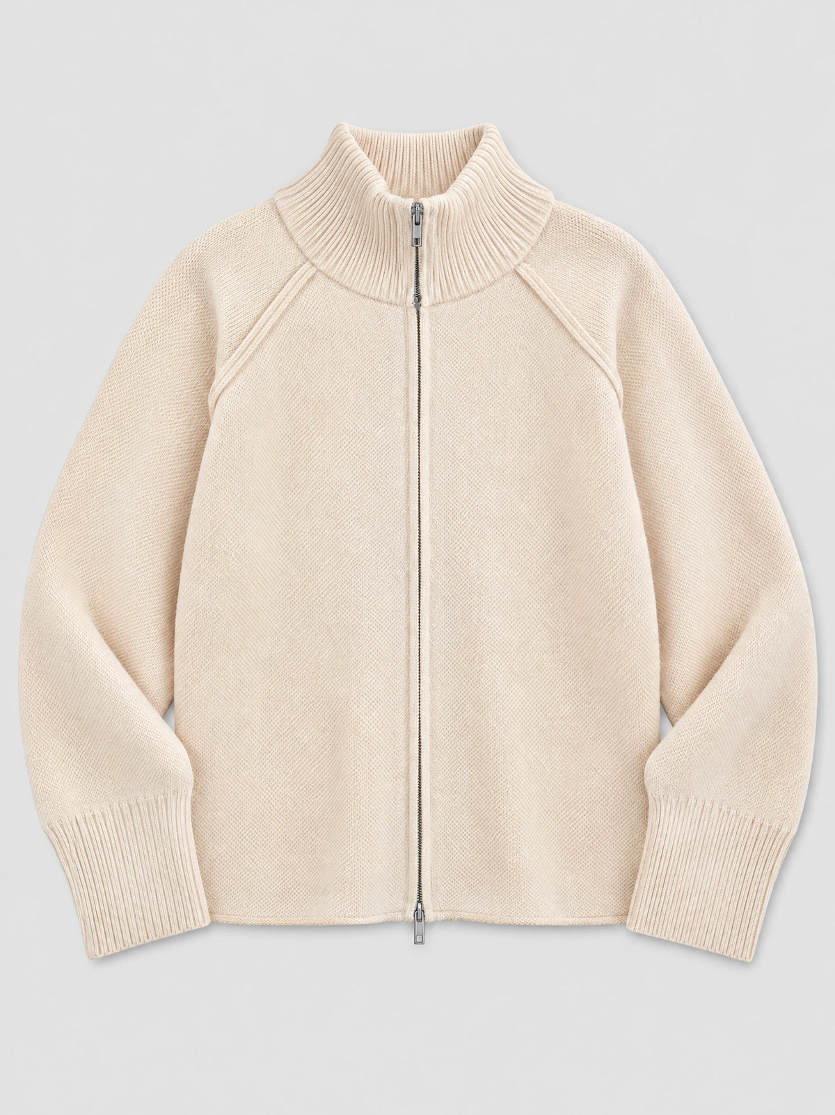 Beige Knit Full Zip Sweater laid flat, featuring a ribbed stand collar, raglan sleeves, and ribbed cuffs.