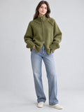 Front studio view of a model wearing a Green knit full zip sweater with a ribbed high collar and cuffs.