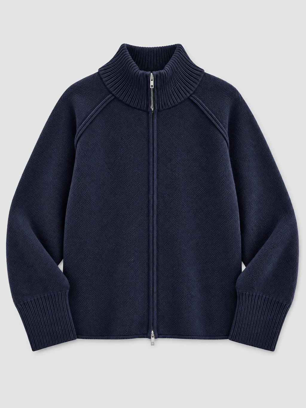 Navy knit full zip sweater laid flat, featuring a ribbed stand collar, ribbed cuffs, and front zipper.