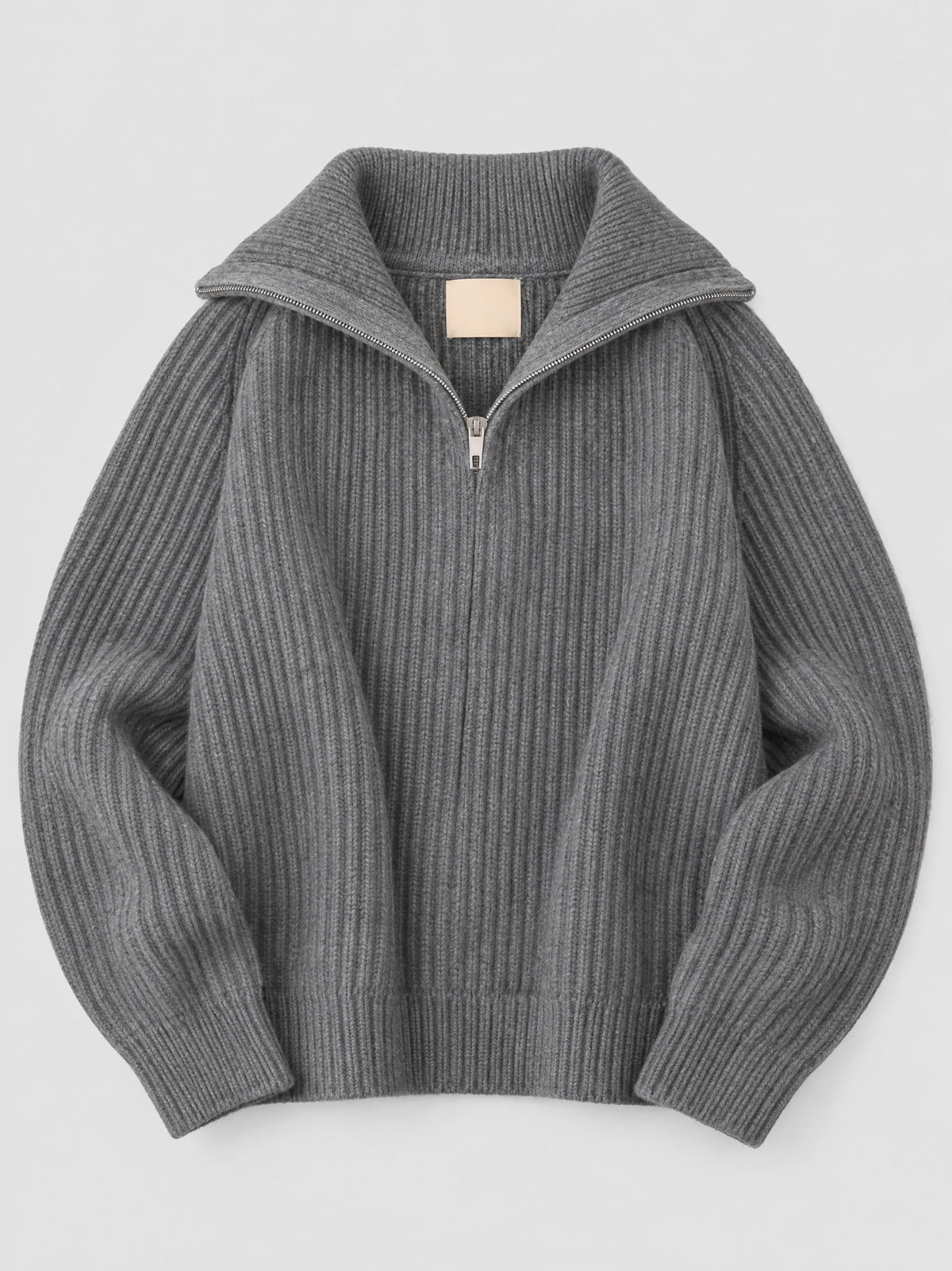 Gray ribbed knit turtle neck cardigan laid flat, featuring a wide zip collar and long sleeves.