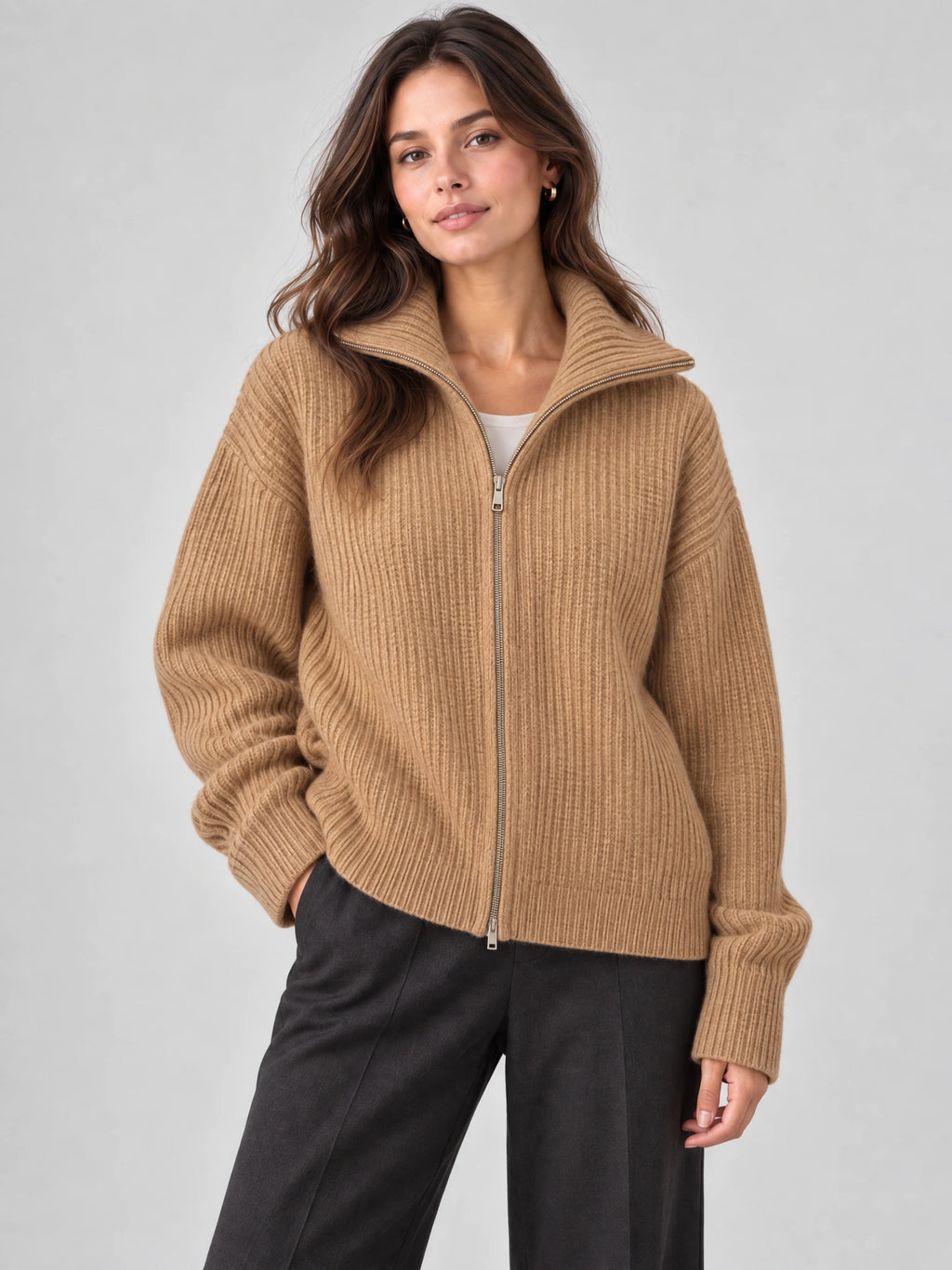 Model wearing a Khaki ribbed knit turtleneck cardigan with a front zipper in a studio view.
