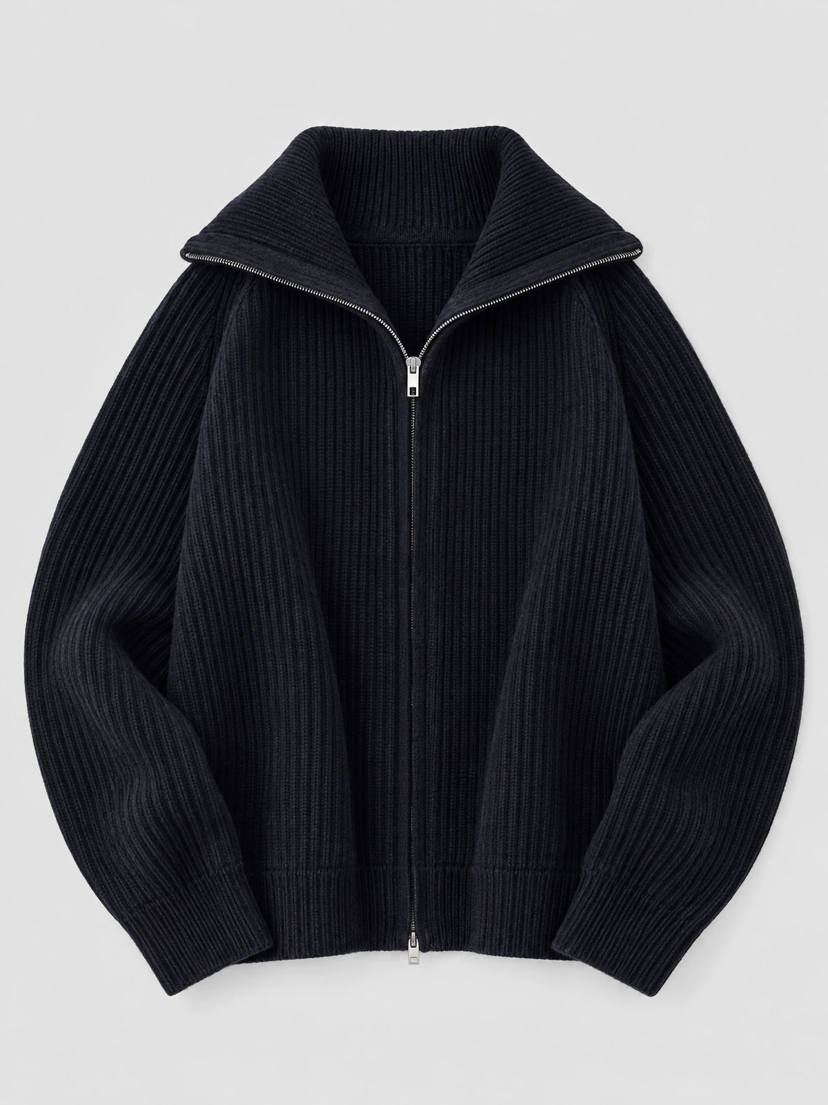 Navy ribbed knit turtle neck cardigan laid flat, featuring a full front zipper and folded high collar.