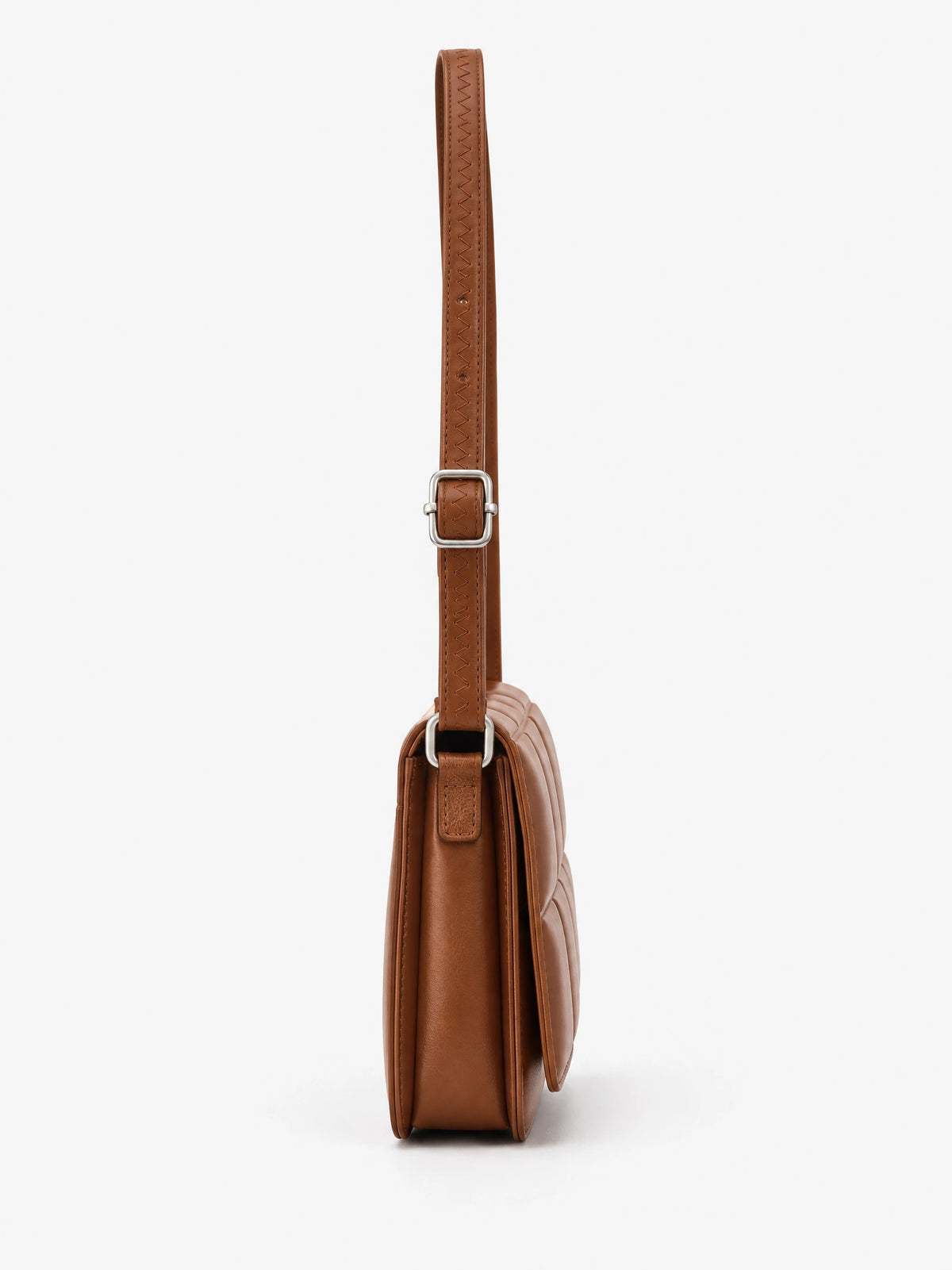 Side view of a Brown leather cross body bag with an adjustable stitched shoulder strap and metal buckle.
