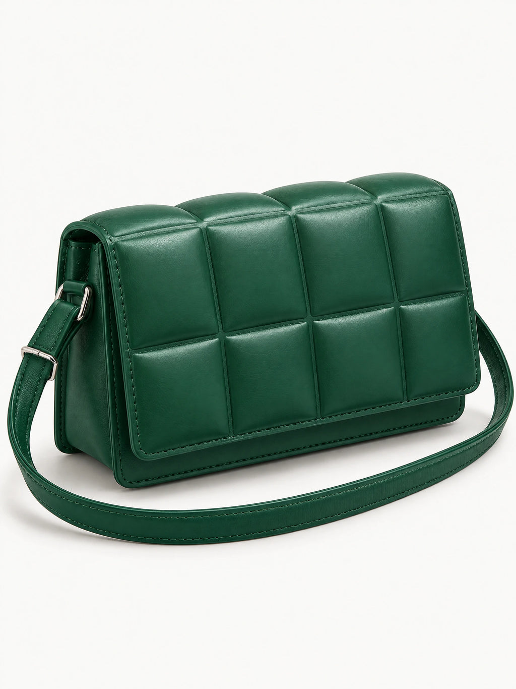 Green leather cross body bag shown at an angle with padded grid panels and an adjustable shoulder strap.