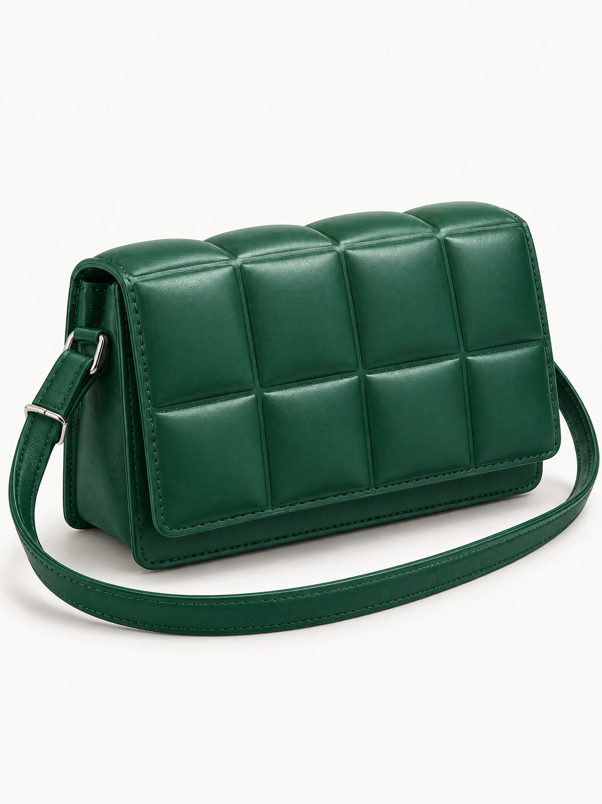 Green leather cross body bag shown at an angle with padded grid panels and an adjustable shoulder strap.