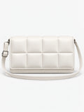 White leather cross body bag shown front-on with a padded grid panel and adjustable shoulder strap.