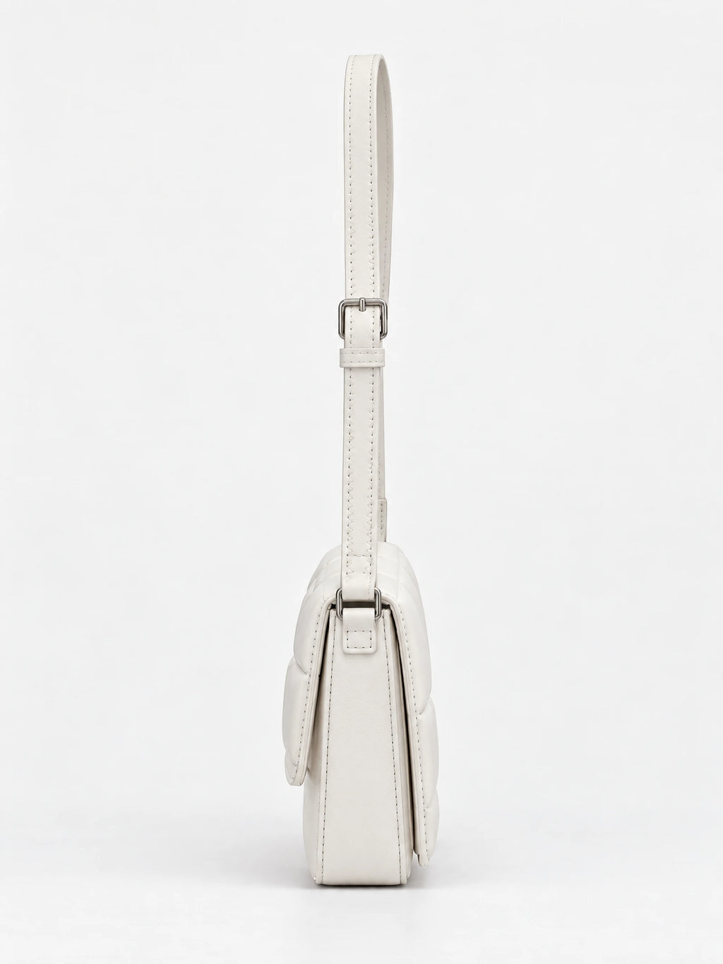Side view of a White leather cross body bag with an adjustable stitched strap and buckle.