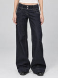 Front studio view of a model wearing Blue Lowe Rise Jeans with a wide-leg fit, contrast stitching, and two-button waistband.