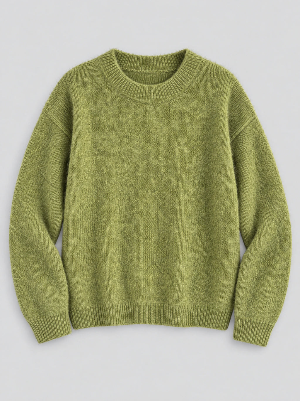 Green women’s mohair winter sweater laid flat, featuring a ribbed crew neckline, cuffs, and hem.