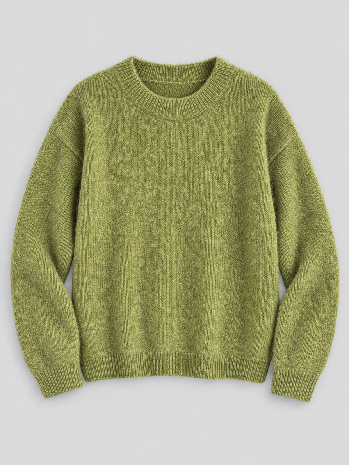 Green women’s mohair winter sweater laid flat, featuring a ribbed crew neckline, cuffs, and hem.