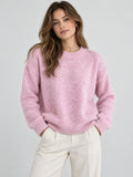 Model wearing a Pink Women Mohair Winter Sweater with a ribbed crew neckline and cuffs in a front studio view.