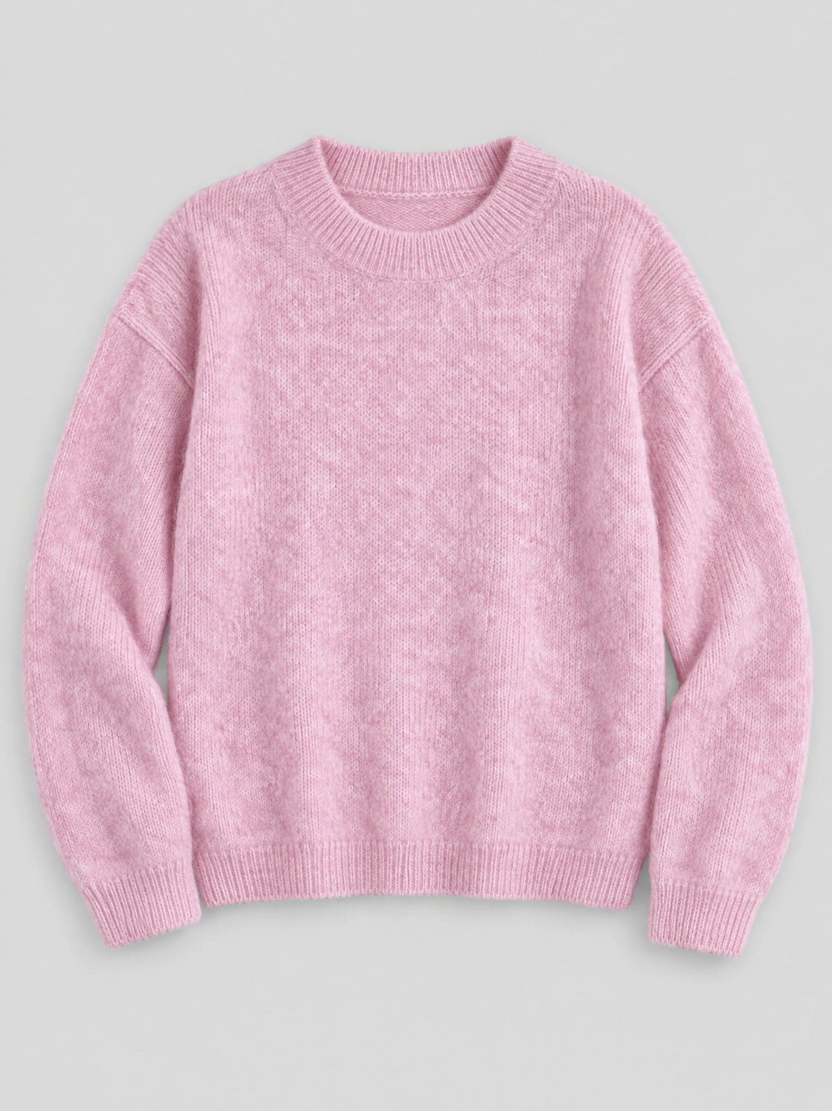 Pink women’s mohair winter sweater laid flat, featuring a ribbed crew neckline, cuffs, and hem.