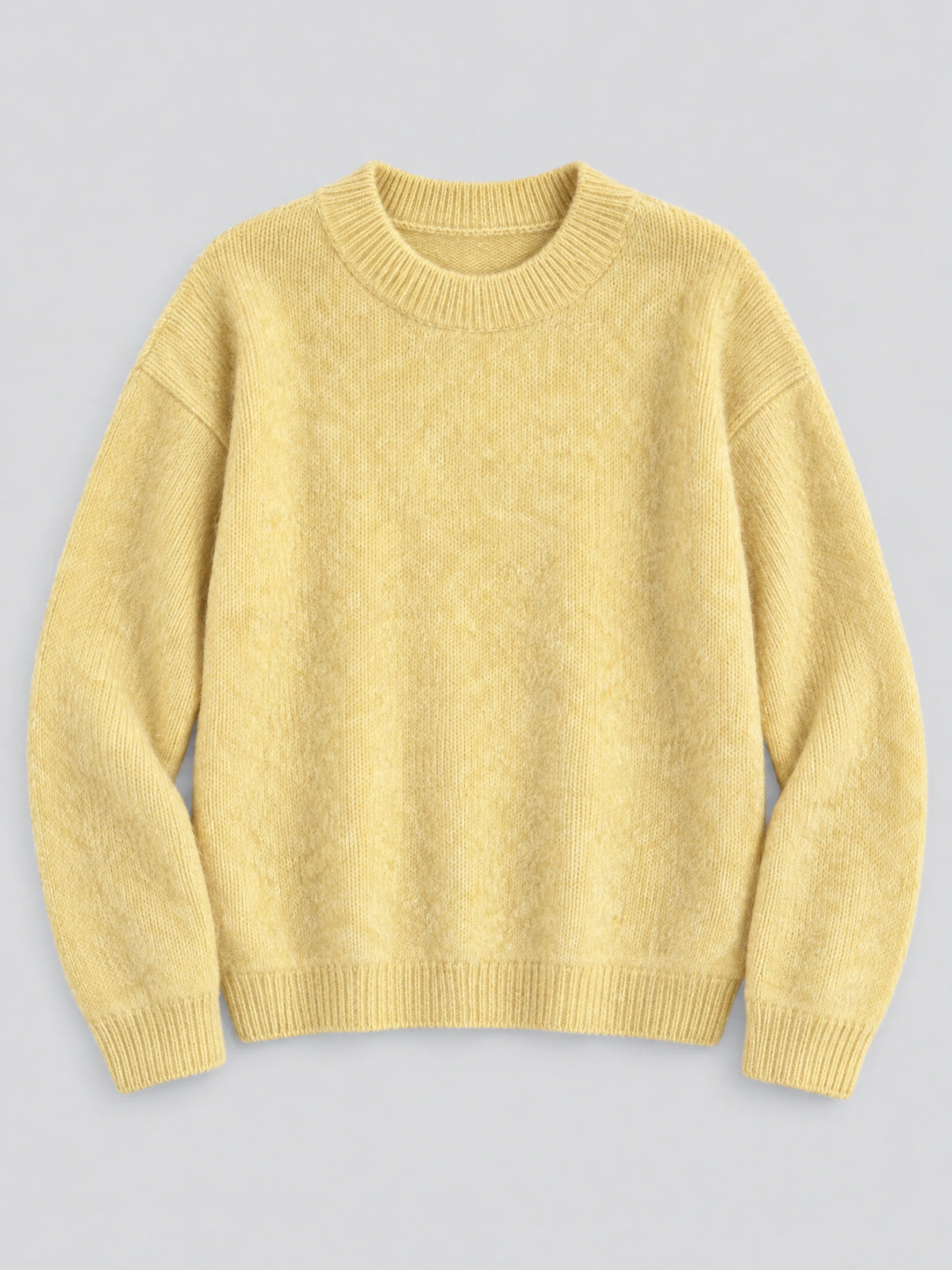 Yellow Women Mohair Winter Sweater laid flat, featuring a ribbed crew neckline, cuffs, and hem.