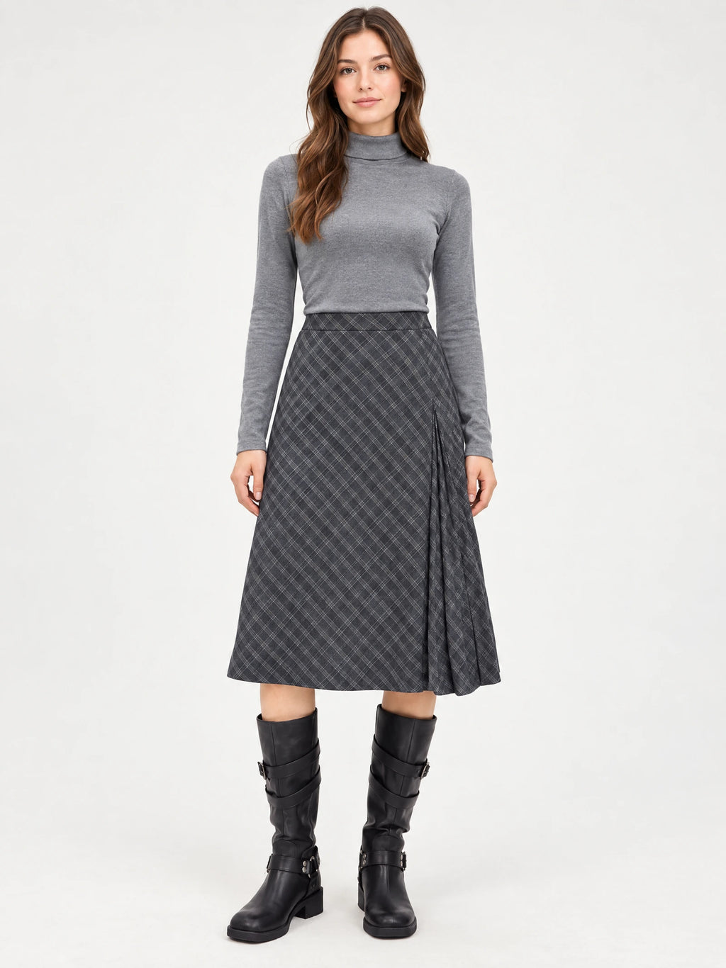 Front studio view of a model wearing a Gray checkered Pleated A-line Skirt with a pleated side panel.