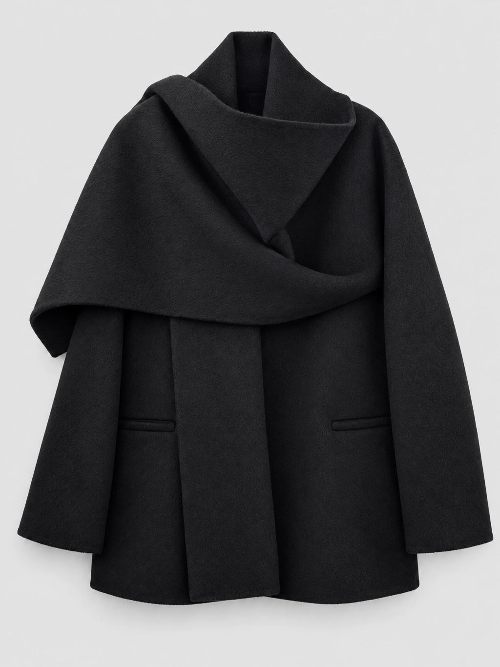 Black women’s wool coat laid flat, featuring an oversized scarf collar, wrap front, long sleeves, and welt pockets.