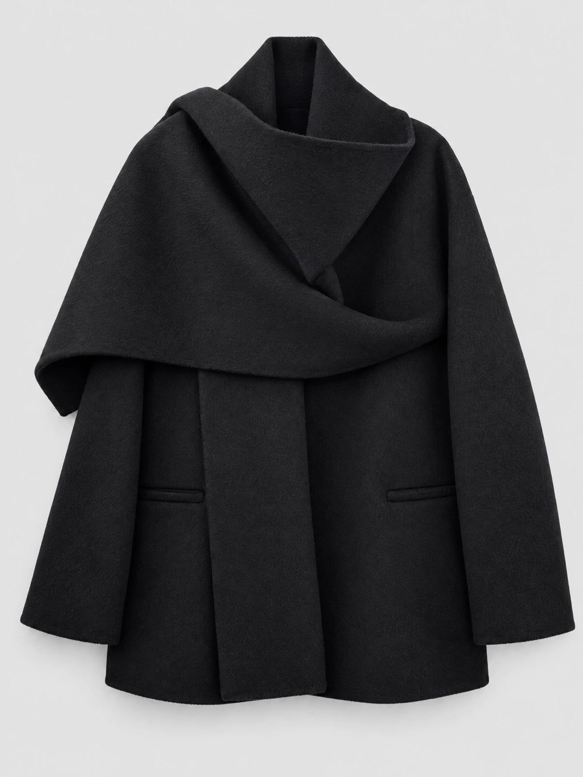 Black women’s wool coat laid flat, featuring an oversized scarf collar, wrap front, long sleeves, and welt pockets.