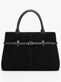 Black suede leather tote bag with dual handles, front stitching, and a belted buckle detail.