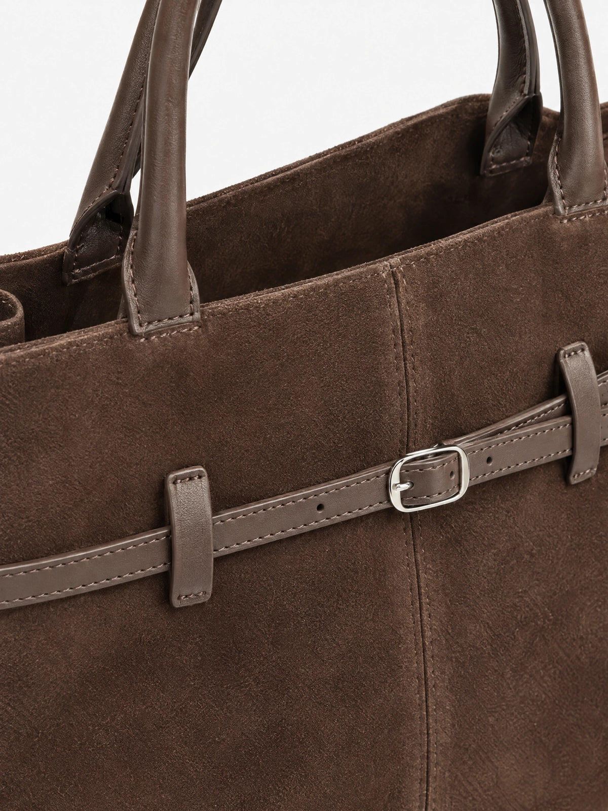 Close-up of the Brown Suede Leather Tote Bag showing stitched handles, textured suede, and an adjustable front buckle strap.