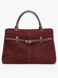 Wine Suede Leather Tote Bag with double handles, front stitching, and a buckle-accented strap.