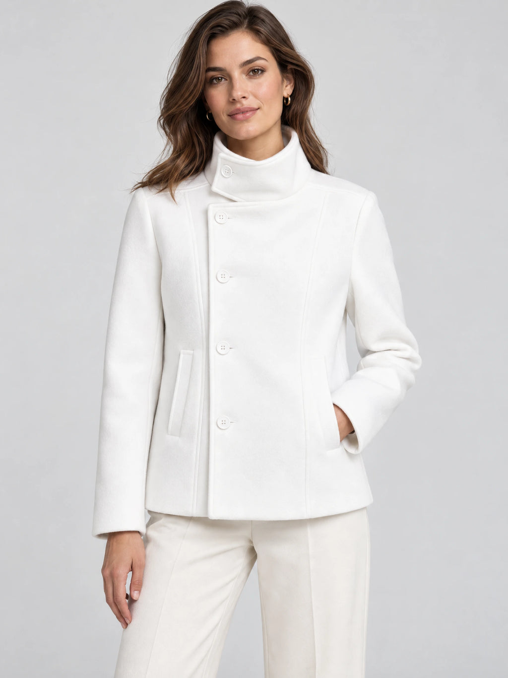 Front studio view of a model wearing a White womens turtleneck coat with button-front closure and angled pockets.