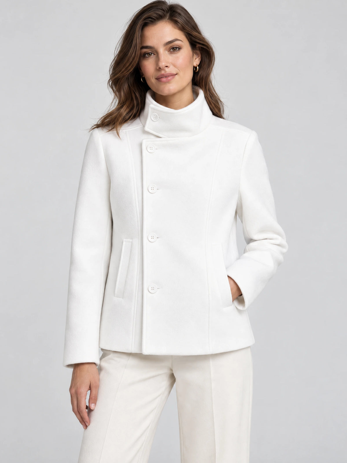 Front studio view of a model wearing a White womens turtleneck coat with button-front closure and angled pockets.