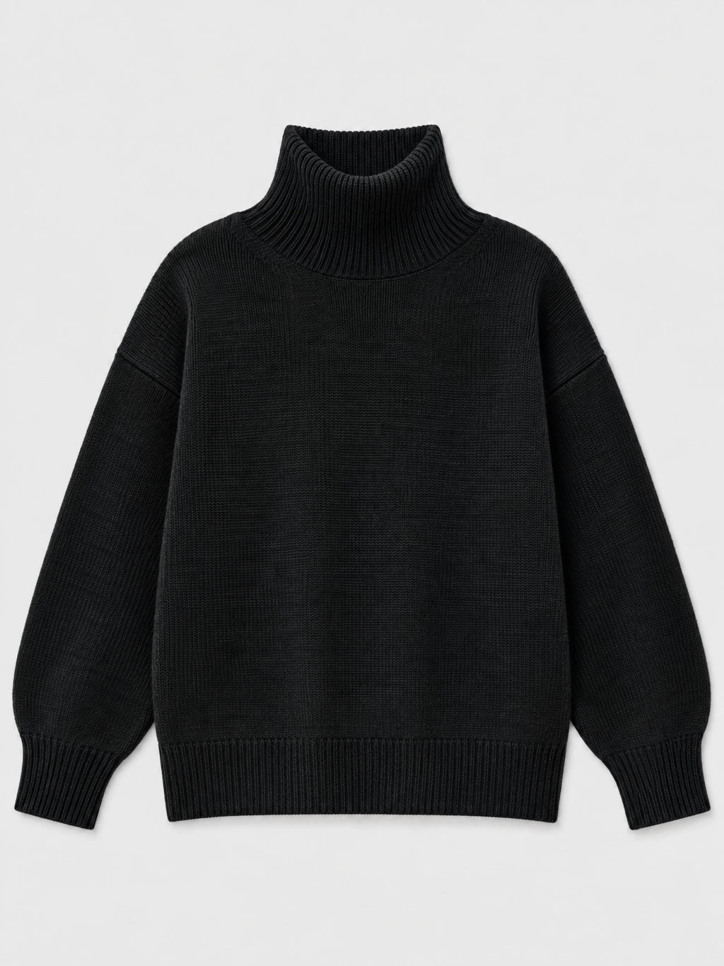 Black women’s turtleneck sweater laid flat, featuring a ribbed high neck, cuffs, and hem.