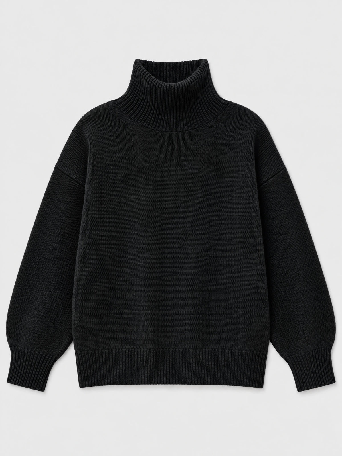 Black women’s turtleneck sweater laid flat, featuring a ribbed high neck, cuffs, and hem.
